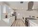 Updated kitchen featuring stainless steel appliances and white cabinetry at 1561 W 5Th St, Mesa, AZ 85201