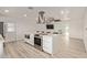 Modern kitchen with large island, stainless steel appliances and hardwood floors at 1561 W 5Th St, Mesa, AZ 85201