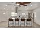 Bright kitchen with an island, stainless steel appliances, and white shaker cabinets at 1561 W 5Th St, Mesa, AZ 85201