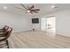 Spacious living room with wood-look floors and access to a sunroom at 1561 W 5Th St, Mesa, AZ 85201