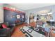 Living room with leather furniture and a view into the kitchen at 16060 W Lupine Ave, Goodyear, AZ 85338