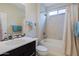 Clean bathroom with tub, shower, and dark vanity at 16918 W Palm Ln, Goodyear, AZ 85395