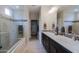 Spa-like bathroom with double sinks, a large shower, and a soaking tub at 16918 W Palm Ln, Goodyear, AZ 85395