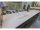 Modern bathroom with a quartz countertop and undermount sink at 16918 W Palm Ln, Goodyear, AZ 85395