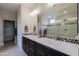 Elegant bathroom featuring double vanities and a walk-in shower at 16918 W Palm Ln, Goodyear, AZ 85395