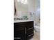 Modern bathroom with a single vanity and a shower/tub combo at 16918 W Palm Ln, Goodyear, AZ 85395