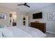 Main bedroom with large TV and dresser at 16918 W Palm Ln, Goodyear, AZ 85395