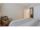Spacious bedroom with a king-size bed and a wood chair at 16918 W Palm Ln, Goodyear, AZ 85395