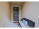 Home entryway with a bench and dark door at 16918 W Palm Ln, Goodyear, AZ 85395