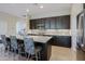 Modern kitchen with stainless steel appliances and an island at 16918 W Palm Ln, Goodyear, AZ 85395