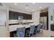 Modern kitchen with stainless steel appliances and an island at 16918 W Palm Ln, Goodyear, AZ 85395