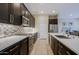 Modern kitchen with stainless steel appliances and an island at 16918 W Palm Ln, Goodyear, AZ 85395