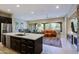 Open concept kitchen flows into living room at 16918 W Palm Ln, Goodyear, AZ 85395