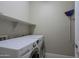 Bright laundry room with washer and dryer at 16918 W Palm Ln, Goodyear, AZ 85395