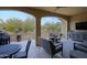 Relaxing outdoor patio with seating area and TV at 16918 W Palm Ln, Goodyear, AZ 85395