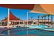 Large resort pool with shade structures and spa at 16918 W Palm Ln, Goodyear, AZ 85395