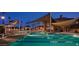 Night view of resort pool with swim lanes at 16918 W Palm Ln, Goodyear, AZ 85395