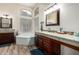 Luxurious bathroom featuring dual vanities, soaking tub, and a spacious layout for relaxation at 18001 N 53Rd St, Scottsdale, AZ 85254