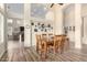 Cozy dining space with wood-look tile, stylish decor, and access to the living area at 18001 N 53Rd St, Scottsdale, AZ 85254