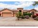 Charming single-story home featuring a well-manicured yard and a spacious three-car garage at 18001 N 53Rd St, Scottsdale, AZ 85254