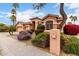 Beautiful home featuring colorful landscaping, a charming mailbox, and a well-maintained exterior at 18001 N 53Rd St, Scottsdale, AZ 85254