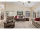 Cozy living room with a large window, plush leather seating and direct access to outdoor patio at 18001 N 53Rd St, Scottsdale, AZ 85254