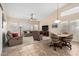 Bright living area with tile flooring, vaulted ceilings, and comfortable seating arrangements at 18001 N 53Rd St, Scottsdale, AZ 85254