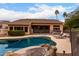 Inviting pool area with lush landscaping and lounge chairs for relaxation and enjoying the sun at 18001 N 53Rd St, Scottsdale, AZ 85254