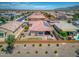 House with solar panels, backyard, and a partial view of surrounding homes at 19684 N 260Th Ave, Buckeye, AZ 85396