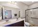 Bathroom boasts dual sinks, a walk-in shower, and modern fixtures at 19684 N 260Th Ave, Buckeye, AZ 85396