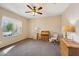 Bright bedroom with carpeted floor and ceiling fan at 19684 N 260Th Ave, Buckeye, AZ 85396