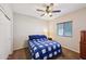 Cozy bedroom with blue and white bedding and ample closet space at 19684 N 260Th Ave, Buckeye, AZ 85396