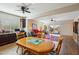 Bright dining area with wood table and chairs, open to the living room at 19684 N 260Th Ave, Buckeye, AZ 85396
