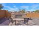 Outdoor stone fireplace with seating area in backyard at 19684 N 260Th Ave, Buckeye, AZ 85396