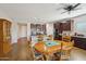 Kitchen features dark wood cabinets, and an island with seating at 19684 N 260Th Ave, Buckeye, AZ 85396