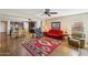 Open concept living room with kitchen view and access to patio at 19684 N 260Th Ave, Buckeye, AZ 85396