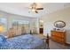 Main bedroom with ceiling fan, and ensuite bathroom access at 19684 N 260Th Ave, Buckeye, AZ 85396