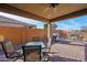 Covered patio features seating area, grill, and fireplace at 19684 N 260Th Ave, Buckeye, AZ 85396