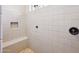 Large walk-in shower with built-in seat and tile surround at 19684 N 260Th Ave, Buckeye, AZ 85396