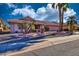 Front yard view of the home with palm trees at 20817 N Gable Hill Dr, Sun City West, AZ 85375