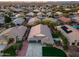 Aerial view of a lovely house with a manicured lawn in a suburban neighborhood, offering great curb appeal at 22852 N 103Rd Ave, Peoria, AZ 85383