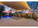 Expansive patio area with pool, outdoor seating, and tranquil ambiance at 22852 N 103Rd Ave, Peoria, AZ 85383