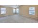 Spacious bedroom featuring carpet and three windows at 22852 N 103Rd Ave, Peoria, AZ 85383