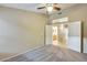 Bedroom featuring a ceiling fan and access to bathroom at 22852 N 103Rd Ave, Peoria, AZ 85383