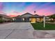 Lovely single-level home with a well-manicured lawn, attractive desert landscaping, and three-car garage at 22852 N 103Rd Ave, Peoria, AZ 85383