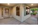 Inviting covered front porch with security door and dual windows provides a warm welcome at 22852 N 103Rd Ave, Peoria, AZ 85383