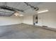 Spacious three-car garage with ample room for vehicles, storage, and potential workshop area at 22852 N 103Rd Ave, Peoria, AZ 85383