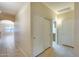 View of hallway with tile flooring and large closet at 22852 N 103Rd Ave, Peoria, AZ 85383