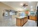 Inviting kitchen with granite countertops, a central island, and adjacent living spaces at 22852 N 103Rd Ave, Peoria, AZ 85383