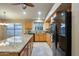 Gourmet kitchen boasting stainless steel appliances, granite counters, and custom cabinetry at 22852 N 103Rd Ave, Peoria, AZ 85383